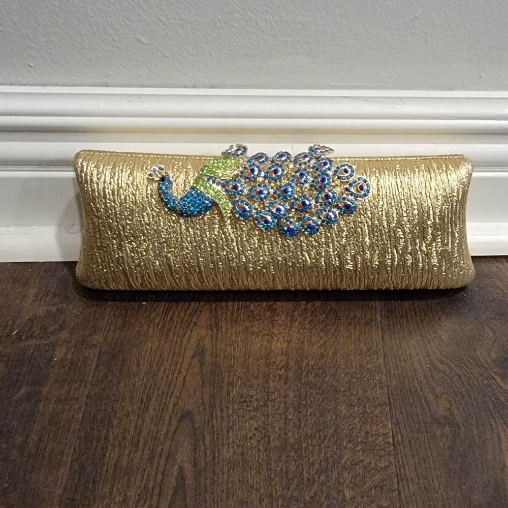 Gold peacock clutch purse.